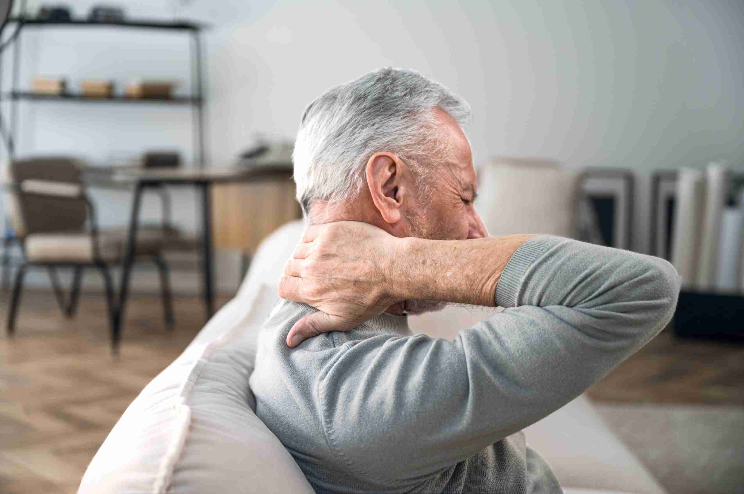 older man experiencing neck and back pain