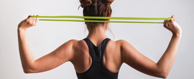 Young athletic woman doing exercises