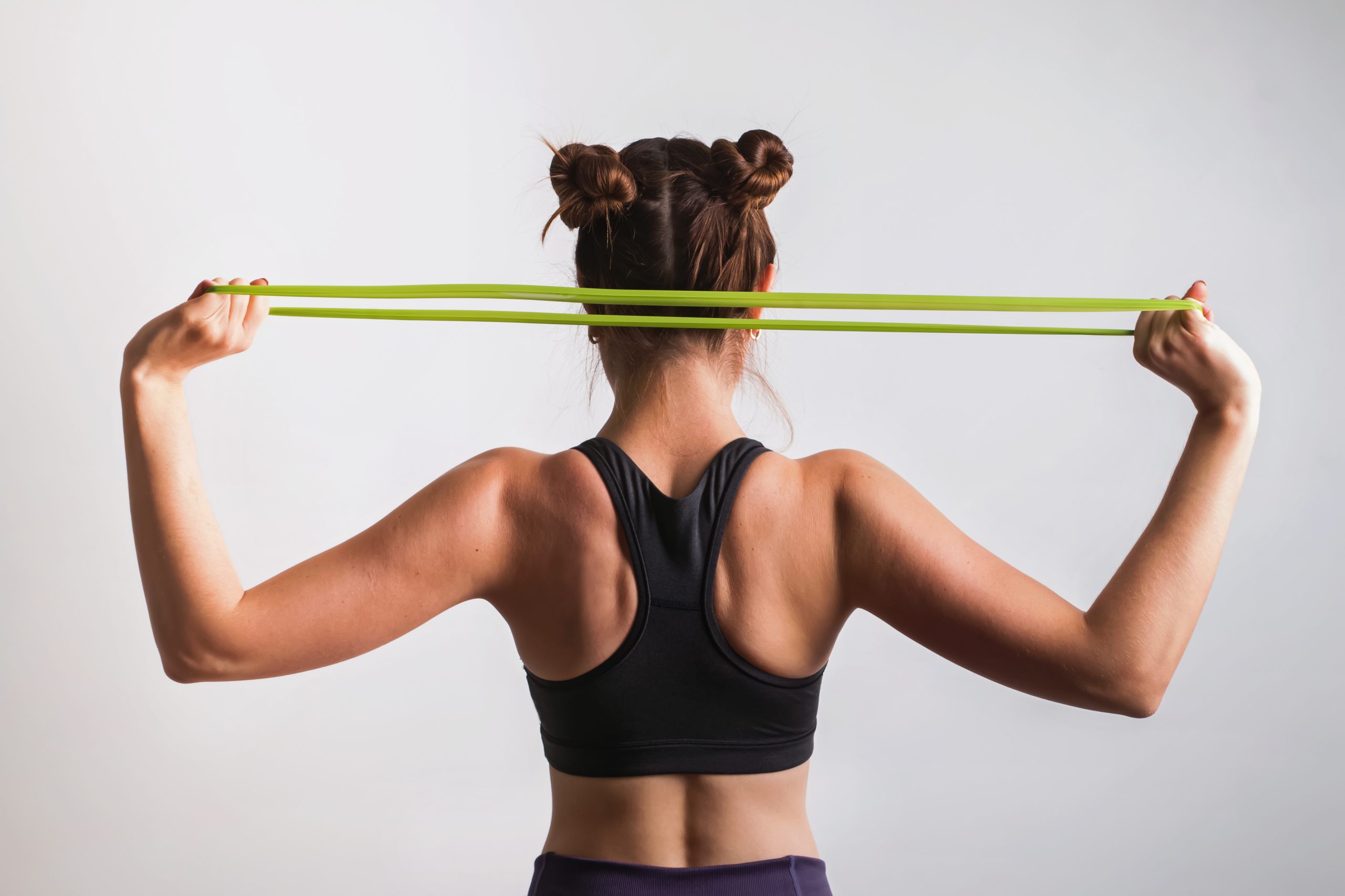 Young athletic woman doing exercises