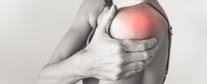 woman with pain in their shoulder joint